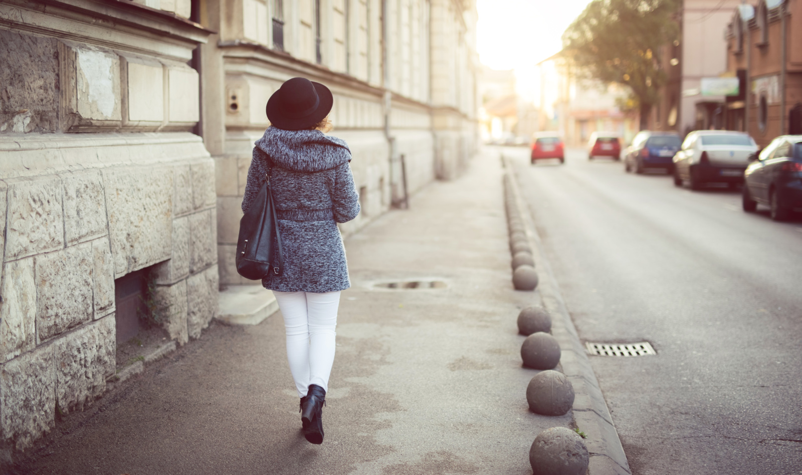 Woman walking over sidewalk