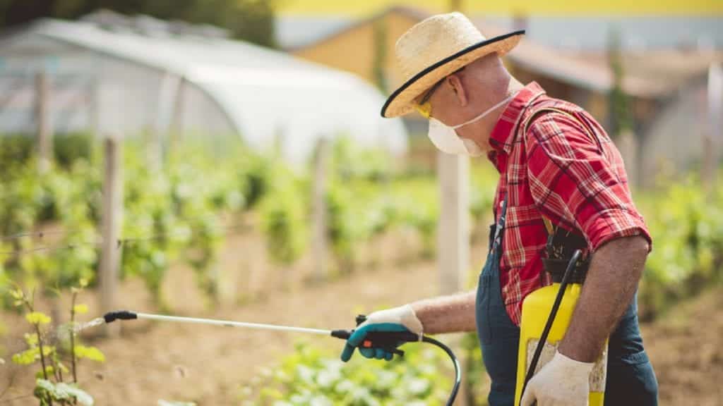 Farmer Spraying Roundup Stock Photo